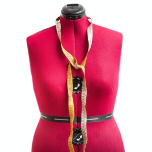 front view of red dress form with measuring tape
