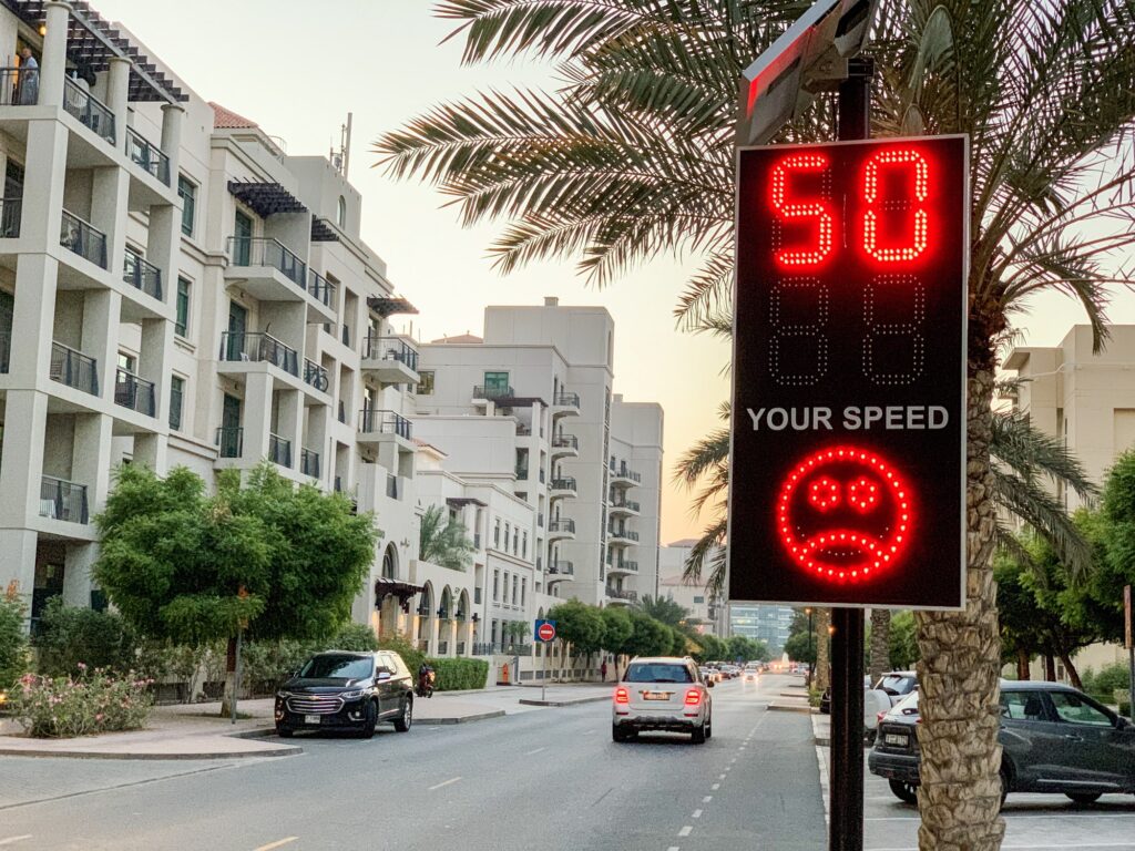 Street sign of speed violation, traffic
