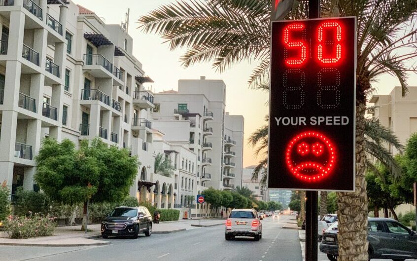 Street sign of speed violation, traffic